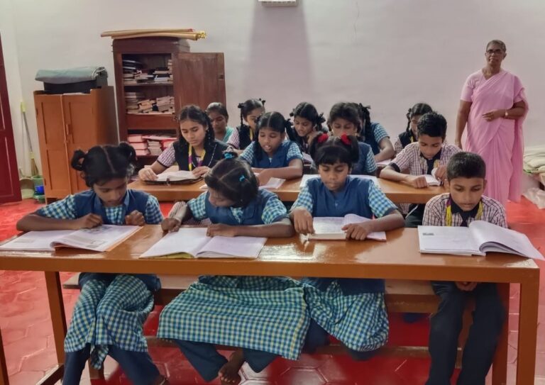 Children studying at desks in Sacred Heart Fatima Home