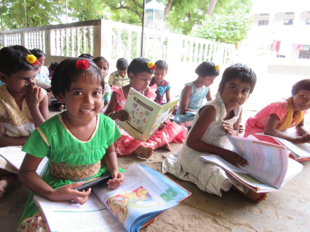 Girls reading and writing together during study hour